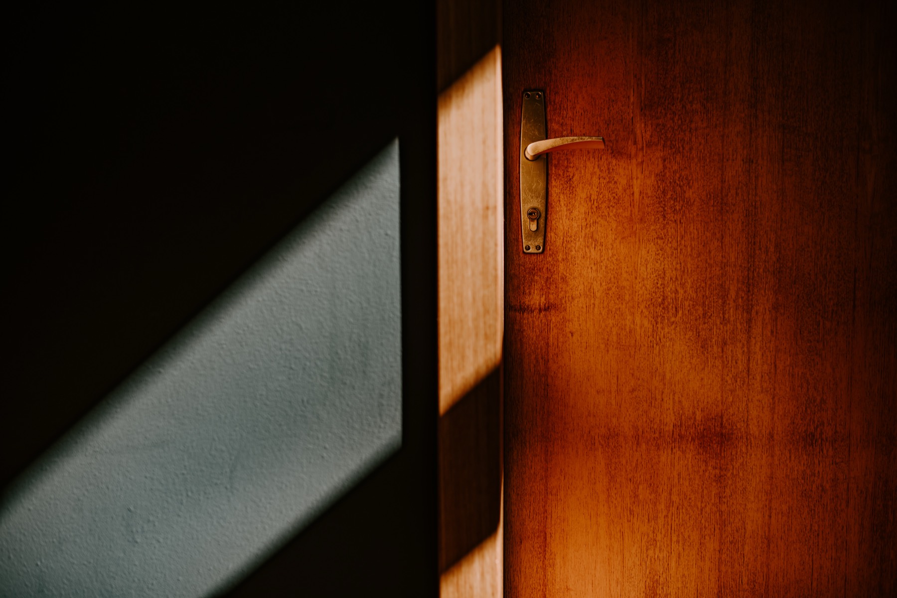 Late sun falling across a timber door